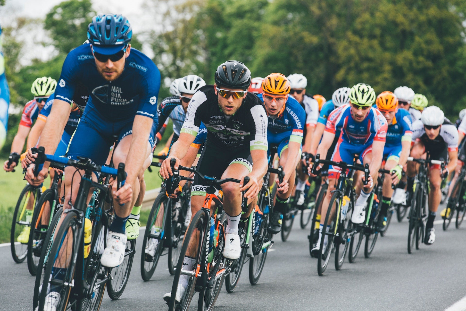 credit Markus Spiske for cycling image, cyclists, HIT, head impact detection